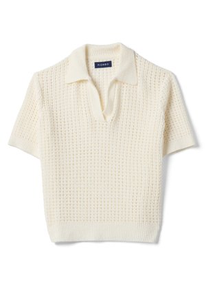 Pull tricoté à manches courtes de couleur crème avec un motif texturé et un col ouvert, étiqueté "Piombo" sur l'étiquette intérieure du col.