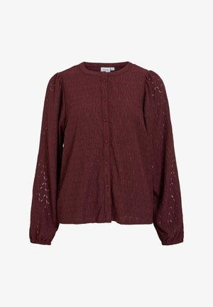 Długa bluzka z guzikami z bordowej koronkowej tkaniny z bufkami na rękawach i okrągłym dekoltem.
