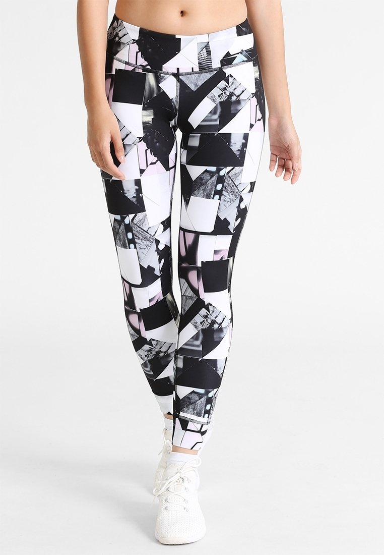 Tajta leggings med geometriska mönster i svart, vitt och rosa. Tillverkade av elastisk tyg, med hög midja och slank design.