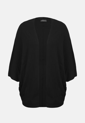 Cardigan noir oversize ouvert sur le devant, manches trois-quarts et coupe ample, présenté sur un fond uni.