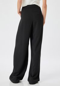 Koton RISE PALAZZO - Pantalones - black