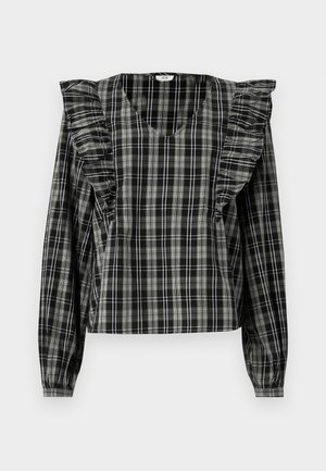 Black and gray checkered blouse with ruffled shoulder accents, long sleeves, and a V-neckline. Made from a lightweight fabric.