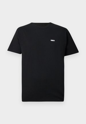 Μαύρο T-shirt με κοντά μανίκια και στρογγυλή λαιμόκοψη, με μικρό λευκό λογότυπο "OBEY" στο αριστερό στήθος.