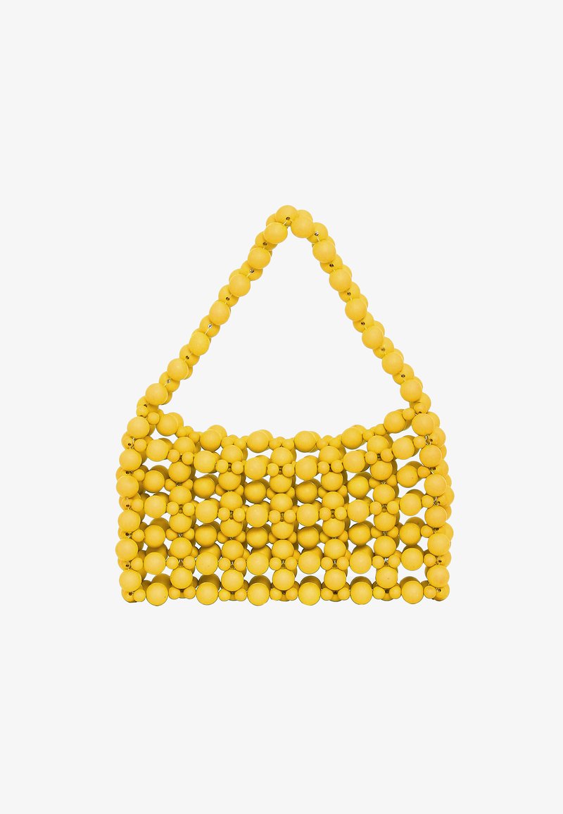 Sárga táska kerek gyöngyökből, rácsmintával és egyetlen vállpánttal. Simának tűnő textúrával és játékos dizájnnal.
