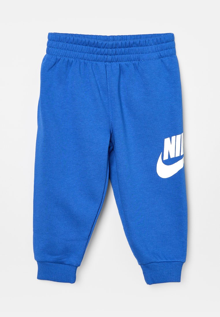 Pantaloni sportivi Nike blu con vita ed orli elasticizzati, dotati di un logo Nike bianco sulla coscia sinistra.