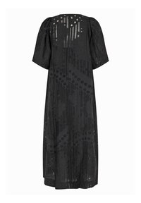 Robe noire avec de courtes manches bouffantes, présentant un motif superposé de points et de rayures, réalisée en tissu texturé léger.