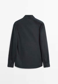 Black long-sleeve shirt with a standard collar, buttons at the cuffs, and a smooth texture, displayed from the back.