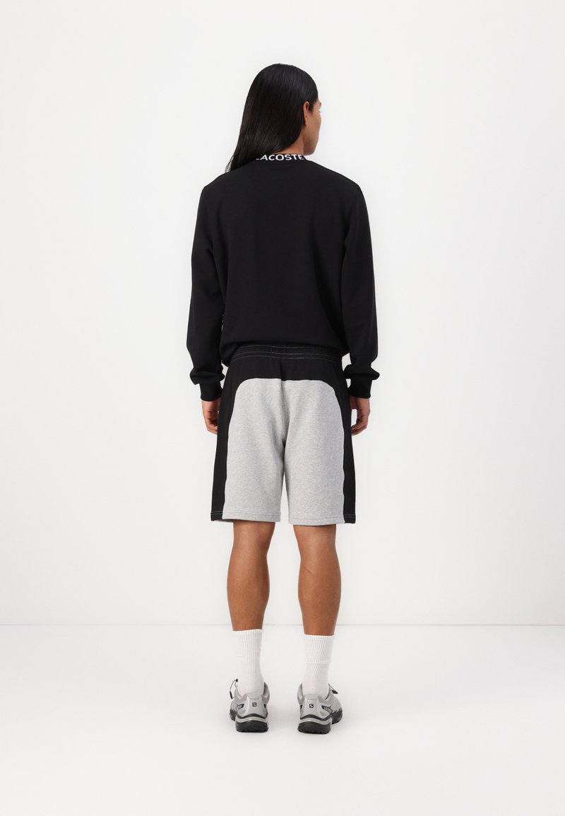 Lacoste Pantalones deportivos silver chine/black/gris