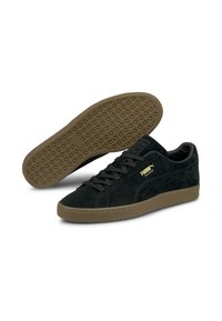 Crne ante sneakersice s smešnim gumiranim đonom, okruglim vrhom i ravnim vezicama. Imaju zlatni logo sa strane i teksturirani uzorak đona.