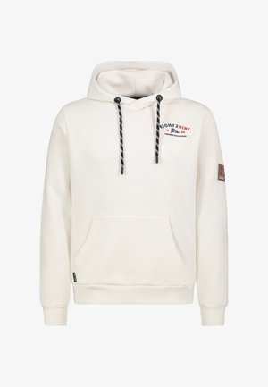 Cremefarbener Kapuzenpullover mit schwarzen und weißen Kordeln, Fronttasche, kleinem roten und schwarzen Schriftzug auf der Brust und einem Aufnäher auf dem linken Ärmel.