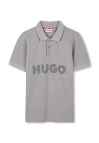 Grijze polo shirt met een gestructureerde afwerking, voorzien van een drievoudige knoopsluiting en een groot "HUGO" logo in contrasterend groen op de borst.