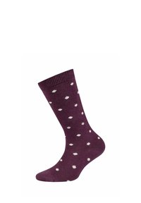 Lila Crew-Socke mit weißen Punkten und geripptem Bündchen, auf einer fußförmigen Form vor einem weißen Hintergrund präsentiert.
