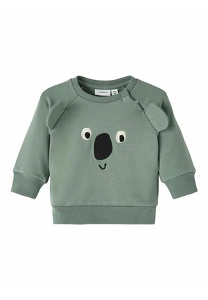 Sweat-shirt vert pour tout-petit avec un motif visage de koala, comprenant des oreilles, yeux, nez cousus et un petit sourire sur le devant.
