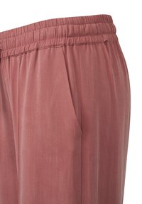 Weiche, leichte Hosen in staubiger Roséfarbe. Mit elastischem Bund und Seitentaschen, glatter Textur und lockerer Passform.