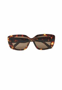 Lunettes de soleil écaille de tortue avec une forme œil de chat, dotées de verres sombres et de montures épaisses et brillantes avec un motif marbré contrastant.