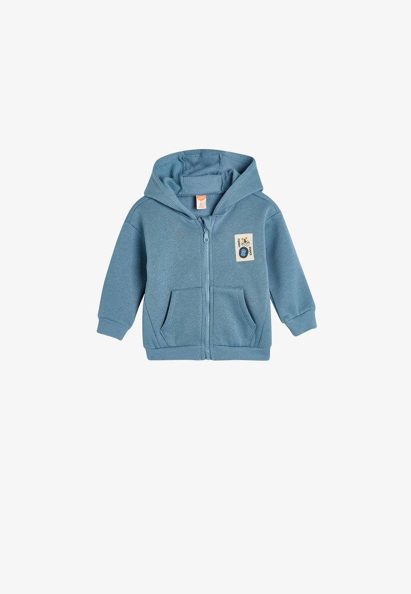 Haut de sweat à capuche bleu clair zippé, en mélange de coton, avec une poche frontale, des poignets côtelés et une étiquette emblématique sur le côté gauche. Design à capuche.