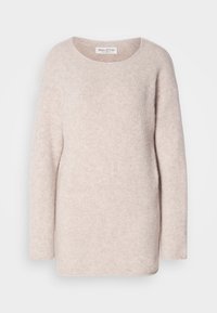 Pull en maille beige clair à manches longues, col rond et texture douce, étiqueté Marc O'Polo.