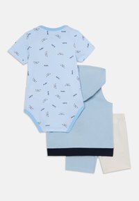 Light blue bodysuit with striped pattern and boat graphics, paired with solid blue sleeveless top and cream-colored shorts. Cotton blend.