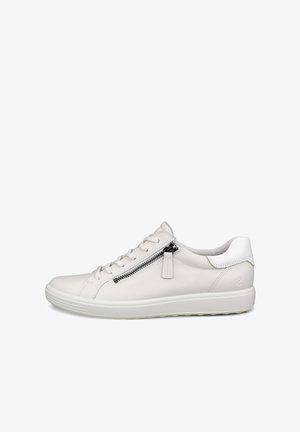 Ljusgrå lädersneaker med en vit häl och en siddragkedja, med platta skosnören och en mönstrad gummisula för bra grepp.