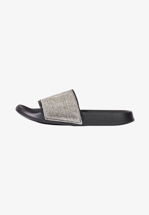 Black slide sandal with a textured rubber base and a wide, metallic silver rhinestone-embellished strap.