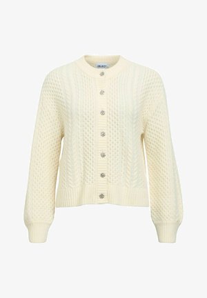 Kremni pleten pulover z dolgimi rokavi, rebrastim robom in šestimi dekorativnimi gumbi spredaj. Povsod vsebuje teksturiran vzorec.