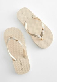 Next FLIP FLOPS  REGULAR FIT - T veida siksniņu sandales - gold glitter
