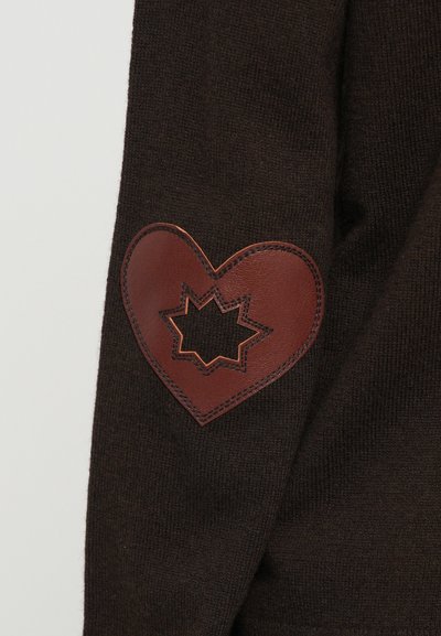 Brown knitted sleeve with a stitched leather heart patch featuring a star-shaped cutout in the center.