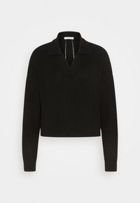 El suéter de punto negro acanalado presenta un escote en V, collares puntiagudos y mangas largas con puños ajustados. Está hecho de un material de punto texturizado.