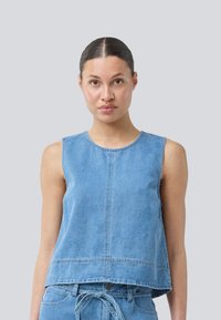 Blue denim sleeveless top with a rounded neckline, straight cut, seam details, and a slightly cropped hem.
