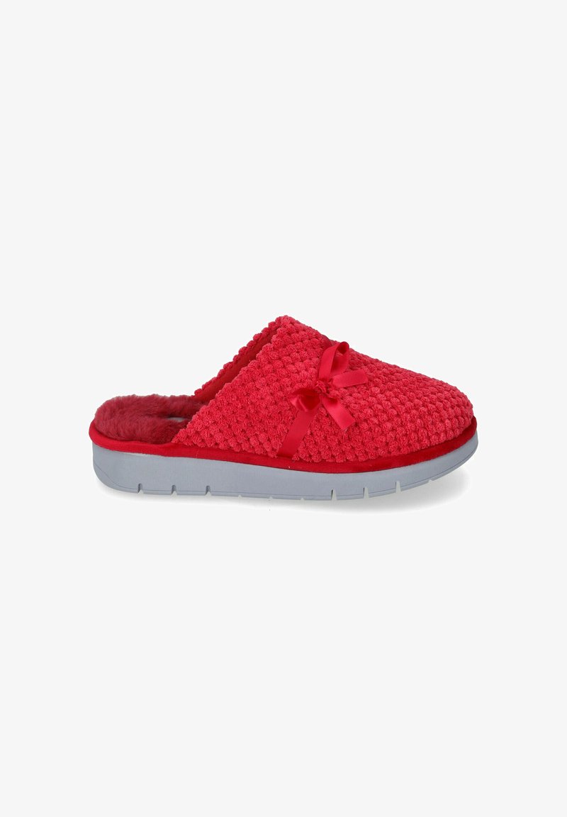 Pantofole rosse lavorate a maglia con un upper testurizzato, interno morbido e suola grigia in gomma. Presentano un fiocco decorativo sulla parte anteriore.