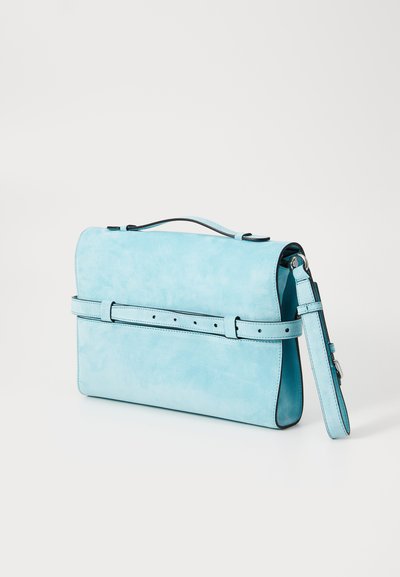 Light blue suede handbag with a structured shape, top handle, adjustable strap, and a belt-like accent across the front.