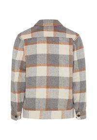 Veste en flanelle à carreaux gris, beige et marron avec col, poignets boutonnés et coupe droite. Texture douce, vue de dos affichée.