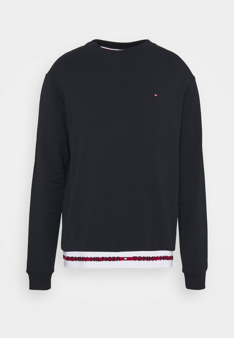 Felpa nera con girocollo, maniche lunghe e orlo bianco con il testo rosso "TOMMY HILFIGER". Tessuto morbido con una superficie liscia.