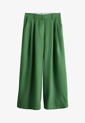 Hoch taillierte, weit geschnittene Hose aus einfarbig grünem Stoff mit vorderen Falten, seitlichen Taschen, Gürtelschlaufen und verdecktem Frontverschluss.