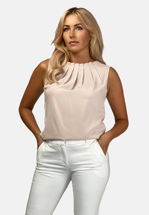 Pale pink sleeveless blouse with pleated design at the neckline, paired with tailored white trousers, featuring side pockets.