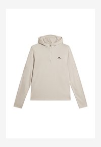 Beige, långärmad huvtröja med halvhög krage. Har en svart logotyp på bröstet och raglanärmar. Slät textur och figurnära design.