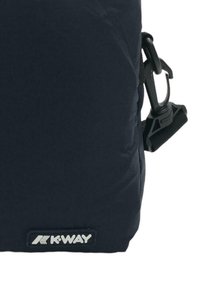 K-WAY backpack in navy fabric featuring a textured surface. Includes a black plastic clip and a rectangular logo patch with white lettering.