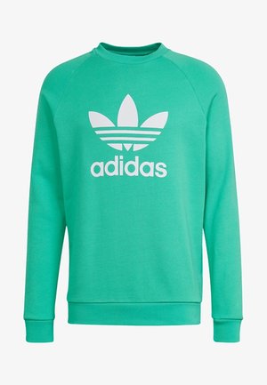Groene sweatshirt met raglanmouwen, een ronde hals en een groot wit Adidas-logo aan de voorkant. Gemaakt van een gestructureerde stof.