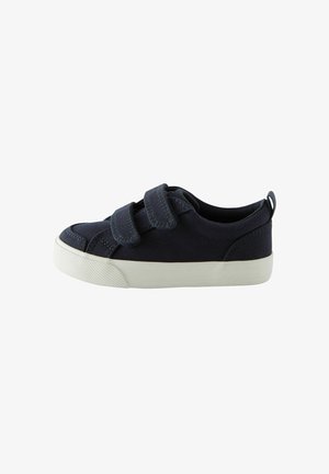 Scarpa in tela blu scuro con due strappi in Velcro, punta arrotondata e suola in gomma bianca con motivo strutturato per una maggiore aderenza.