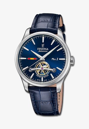 Blue-dial Festina Balancier wristwatch with silver hands, open balance wheel, limited edition text, and blue leather strap with stitch details.