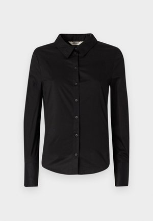 Svart langermet skjorte laget av bomull. Har en krage, knappestopp i front og et tettsittende design. Glatt tekstur og skreddersydd fasong.