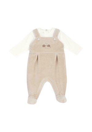 Tutina morbida beige per neonato con maniche lunghe bianche, piedi attaccati, spalline con bottoni e piccolo ricamo di riccio sul petto.