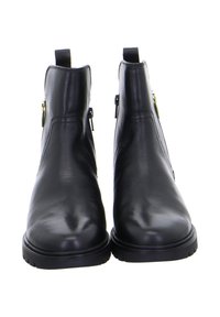 Schwarze Leder-Stiefeletten mit glatter Textur, seitlichen Reißverschlüssen und Ziehhilfen, ausgestattet mit einer robusten schwarzen Gummisohle und minimalistischem Design.