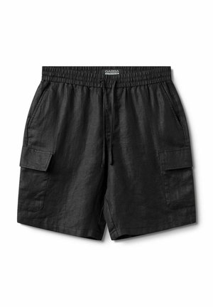 Black linen shorts with an elastic waistband, front drawstring, and two side cargo pockets. Smooth texture, loose fit, and mid-thigh length.