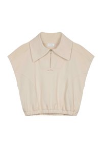Top cropped beige avec un grand col, des manches courtes et une fermeture éclair à l'avant. Il présente un ourlet froncé et une texture subtile. Étiquette de marque à l'intérieur.