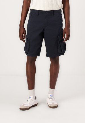Navy cargo shorts with side pockets, crafted from durable cotton material. Features a straight leg design and a regular waistband.