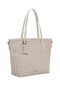 Sac fourre-tout avec un motif texturé géométrique en beige et crème. Présente des anses longues, un accent métallique et une étiquette amovible.