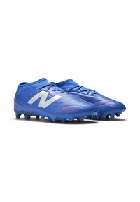 Blue soccer cleats with a textured synthetic upper, featuring a white "N" logo, pink accents, and black molded studs for traction.