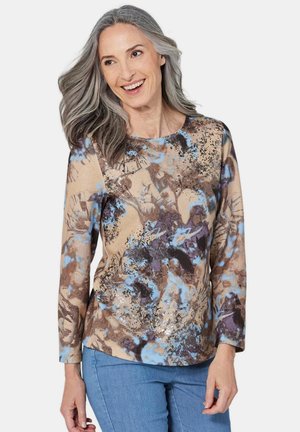Langärmelig shirt van zachte stof met een beige, bruine en blauwe bloemenprint. Heeft een ronde halslijn en een losse pasvorm.