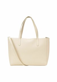 Sac fourre-tout en cuir beige avec des doubles poignées et une bandoulière amovible. Surface texturée, fermeture éclair et design minimaliste.